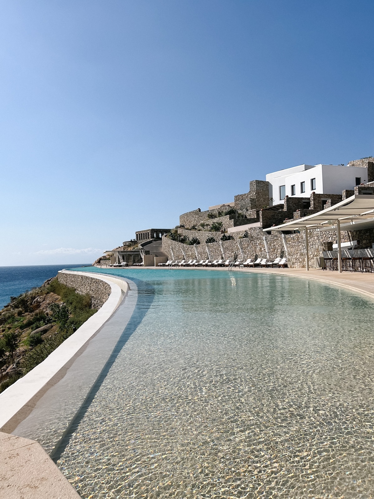 An infinity pool at Cali Mykonos 5 star hotel in Greece.